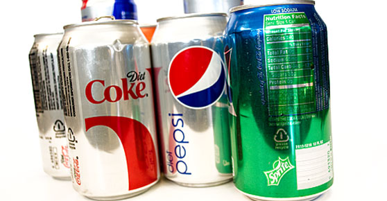 Aluminum Cans - Assorted soda cans on white background