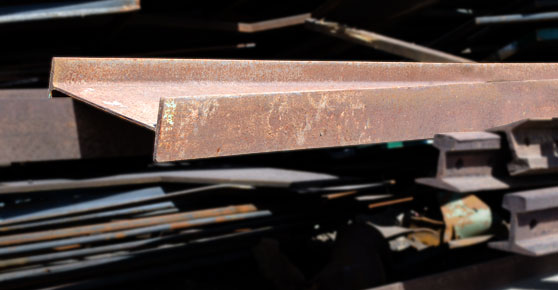 Structural Steel - Plate & Structural Steel metal pieces stacked in a pile