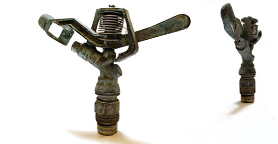 Brass Sprinkler - A pair of bronze sculptures, part of the "Sprinkler Brass" collection, portraying a man and a woman