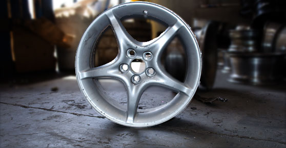 Car wheel Rim - Wheel with silver rim on the ground