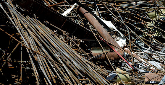 HMS-Steel - North American Recycling A brass pipe fitting on a white surface, suitable for plumbing projects.